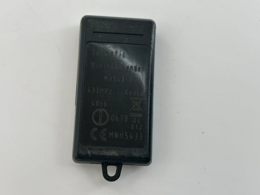 Tormatic. Hand transmitter, handle, remote control, radio button, radio remote control