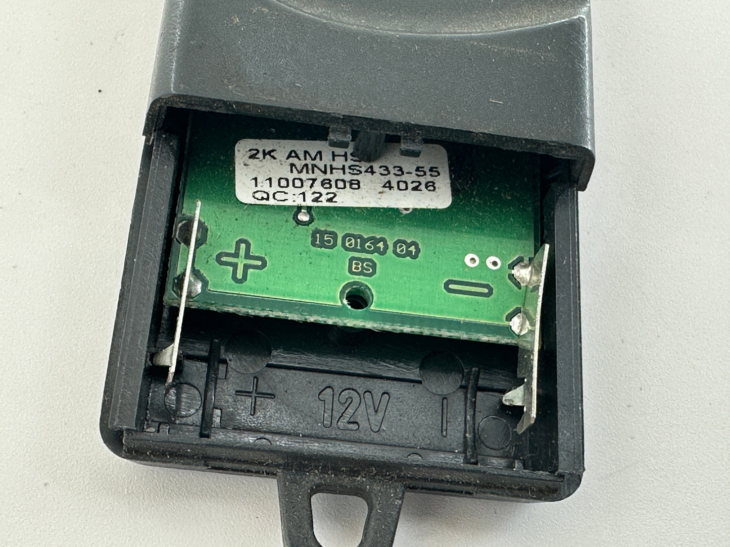Tormatic. Hand transmitter, handle, remote control, radio button, radio remote control